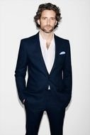 male fashion model in a dark blue office suit