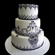 three-tier cake on a black background