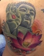 tattoo with Buddha and lotus