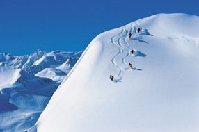 People are skiing on the snowy mountain
