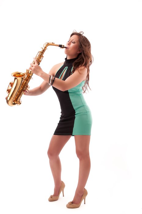 young sexy Girl Plays Saxophone