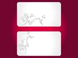 two white cards on burgundy background