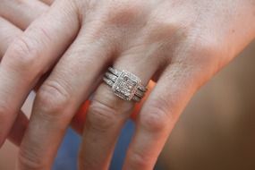 engagement ring with diamonds on the hand