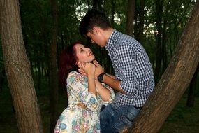 couple in love on the background of tree in the evening