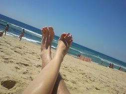 photo of the feet on the beach