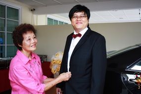 Asian man in a wedding suit