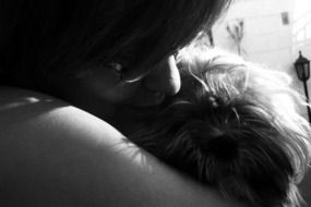 woman kisses her pet