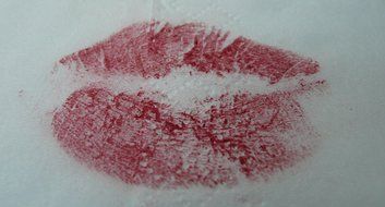 imprint of kissing lips on paper