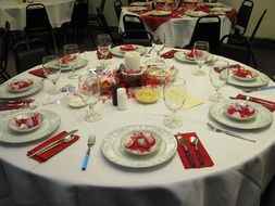 festive table setting with red napkins