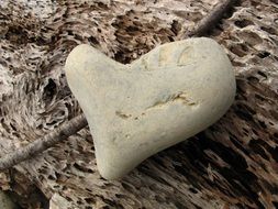 heart form stone on wooden background