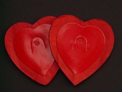 Double red hearts on a black background