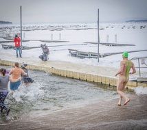 winter swimmer coming into the cold water