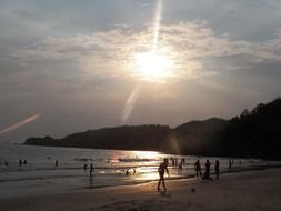 holidaymakers on the beach in Guaraquesaba Brazil