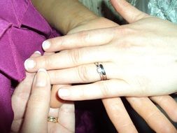 wedding rings on male and female hands