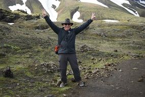 Happy man in hat mountain view