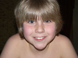 portrait of a boy on a black background