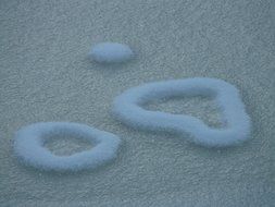 snow on ice in heart form