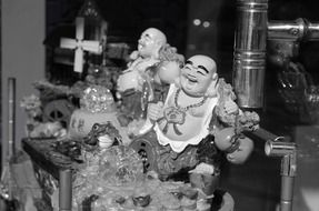 statues of happy buddhas, black and white