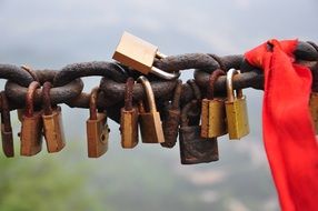 love locks on rusty chain