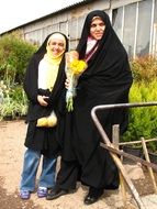 mother and daughter in Muslim clothes