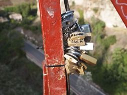 love locks on metal bar