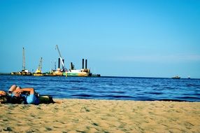 couple lying on a sandy beach