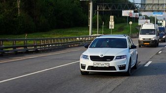 moving white skoda car