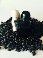 ceramic fig in coffee beans