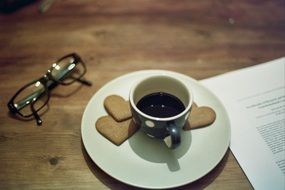 cup of coffee with heart shaped cookies for a break