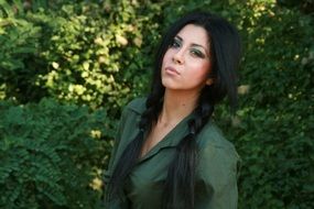 girl in green blazer in the forest
