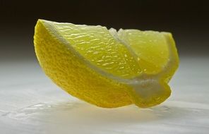 piece of a sour yellow lemon