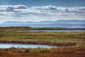 wild landscape of lakes and mountains