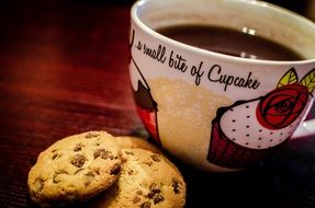 big cup of espresso with chocolate chip cookies