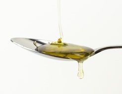 oil spilled on a tablespoon