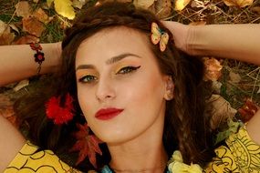 portrait of a seductive girl with makeup in autumn style