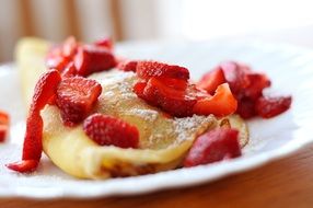 freshly baked breakfast pankakes with strawberries