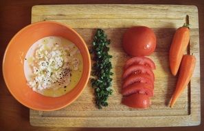 healthy breaskfast with fresh vegetables on a wooden tray
