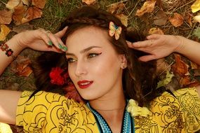 the autumn image of girl on a background of autumn leaves