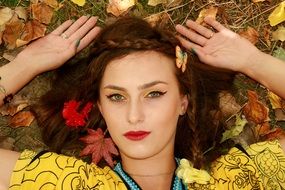 the autumn image of girl with opened eyes