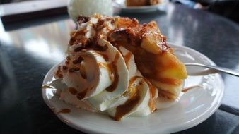 large slice of a caremel apple pie