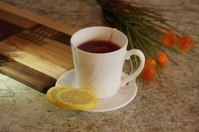 cup of tea with lemon on the table