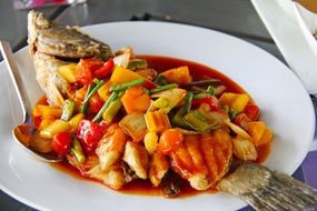 fried spicy fish with sweet and sour asian cuisine sauce