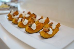 sweet pumpkin with sour cream and nuts