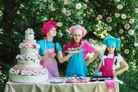 three little girls having a bake sale