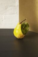 fresh yellow pear on the dark surface
