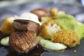 big dish of different fried meats and vegetables
