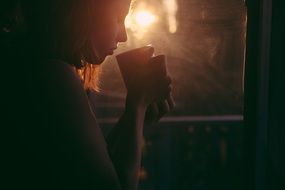 girl drinking cup of tea