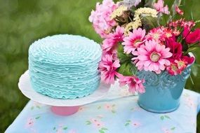 colorful cake birthday and beautiful flowers in a bucket