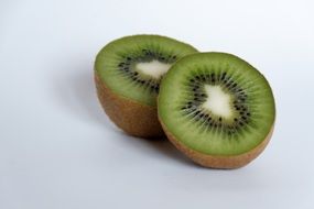 healthy green kiwi fruit cut into halfs