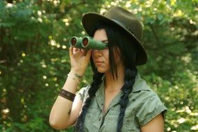 girl studing and exploring the wild forest